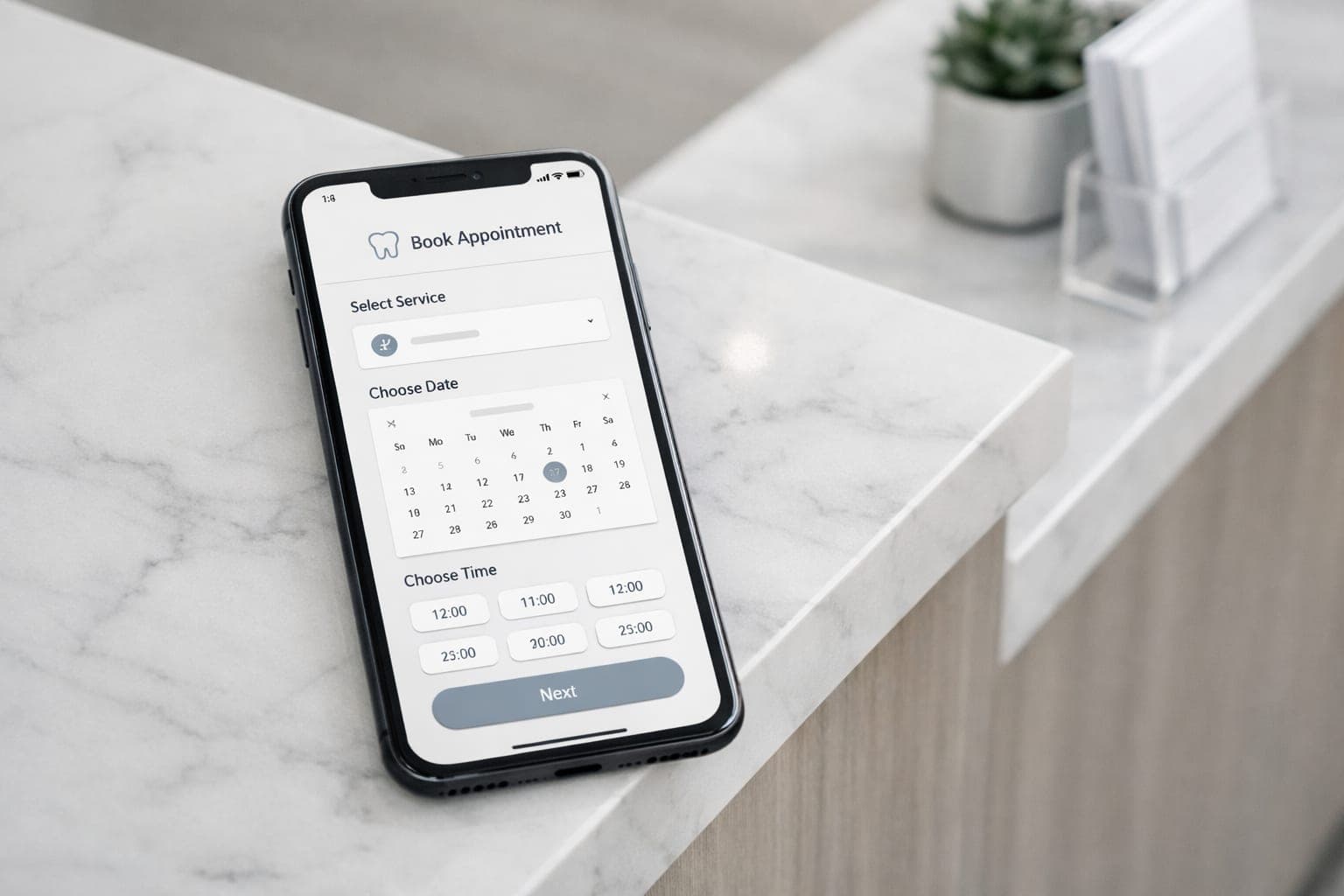 Smartphone displaying a minimalist dental booking interface on a marble reception desk for online patient forms dental clinics.