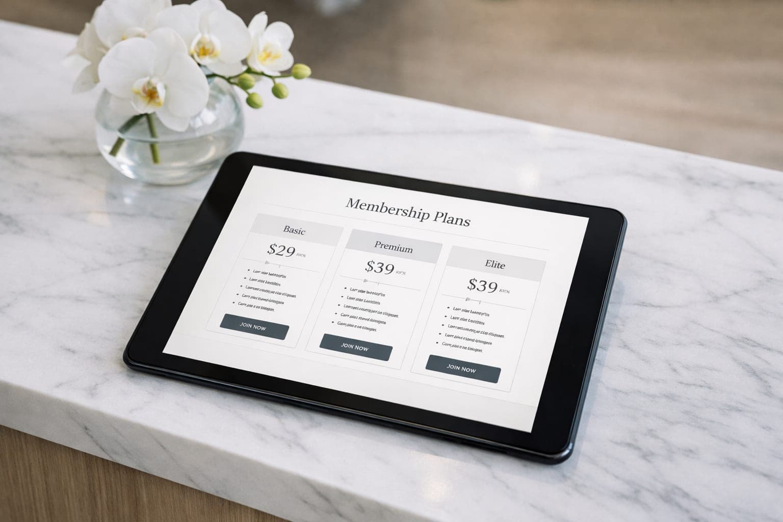 Tablet showing a clean med spa membership pricing page on a marble reception desk with white orchids.